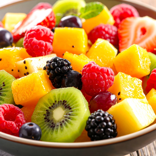 A colorful bowl of fresh tropical fruit and berries at the Elements of the Soul Retreat by Eclectic Lyfe LLC.